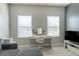 Bedroom featuring a vanity desk, a sofa, and light wood floors at 9575 Silver Buttonwood St, Orlando, FL 32832