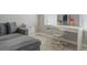 Bedroom featuring a vanity desk, a sofa and light wood floors at 9575 Silver Buttonwood St, Orlando, FL 32832