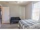 Bright bedroom includes a sofa, window and two doors at 9575 Silver Buttonwood St, Orlando, FL 32832
