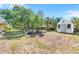 Large backyard with a patio and shed, providing ample space for outdoor activities and storage at 980 Oleander Se Dr, Winter Haven, FL 33880