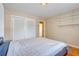 Bright bedroom with storage closet and a view into the hallway at 980 Oleander Se Dr, Winter Haven, FL 33880