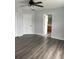 Bedroom featuring modern ceiling fan, gray walls, and vinyl plank flooring at 1117 Cambourne Dr, Kissimmee, FL 34758