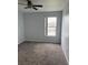 Bedroom with ceiling fan, one window, carpet floors and neutral paint at 1117 Cambourne Dr, Kissimmee, FL 34758