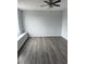 Bedroom with vinyl floors and a large window at 1117 Cambourne Dr, Kissimmee, FL 34758