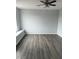 Bedroom with vinyl floors and a large window at 1117 Cambourne Dr, Kissimmee, FL 34758