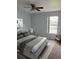 Bedroom with ceiling fan, one window, carpet floors and a comfortable bed at 1117 Cambourne Dr, Kissimmee, FL 34758