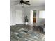 Bedroom featuring modern ceiling fan, gray walls, and vinyl plank flooring at 1117 Cambourne Dr, Kissimmee, FL 34758