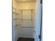 Walk-in closet features shelving and carpeted floor at 1117 Cambourne Dr, Kissimmee, FL 34758