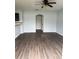 Bright living room featuring an arched doorway and modern ceiling fan at 1117 Cambourne Dr, Kissimmee, FL 34758