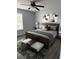 Main bedroom with ceiling fan, neutral decor and modern furnishings at 1117 Cambourne Dr, Kissimmee, FL 34758