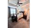 Comfortable bedroom with tray ceiling and large window at 11588 Whistling Pine Way, Orlando, FL 32832