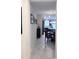 Open hallway leading to dining area and kitchen with stylish decor and lighting at 11588 Whistling Pine Way, Orlando, FL 32832