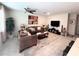 Inviting living room with comfortable seating, ceiling fan, and stylish decor at 11588 Whistling Pine Way, Orlando, FL 32832