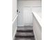 Carpeted staircase with white railings at 11588 Whistling Pine Way, Orlando, FL 32832