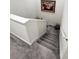 Carpeted staircase with white railings and framed picture at 11588 Whistling Pine Way, Orlando, FL 32832