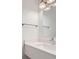 Modern bathroom with a sleek white vanity, chrome fixtures, and contemporary lighting at 1209 S Station Pl # 306, Orlando, FL 32809
