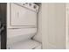A stacked washer and dryer provide convenience and efficiency in this home's laundry area at 1209 S Station Pl # 306, Orlando, FL 32809
