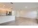 Open-concept living space featuring wood-look floors, stainless steel appliances, and granite countertops at 1209 S Station Pl # 306, Orlando, FL 32809