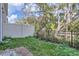 View of backyard with partial fence and lush foliage at 1217 S Station Pl # 502, Orlando, FL 32809