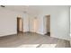 Large bedroom with wood floors and multiple doorways at 1217 S Station Pl # 502, Orlando, FL 32809