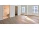 Bright bedroom with light wood floors and ensuite bathroom at 1217 S Station Pl # 502, Orlando, FL 32809