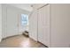 Townhome entryway with wood floors, stairs, closet, and natural light at 1217 S Station Pl # 502, Orlando, FL 32809