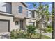 Townhome featuring single car garage, small front yard with professional landscaping at 1217 S Station Pl # 502, Orlando, FL 32809