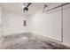 Spacious garage with concrete floors and an automatic door opener at 1217 S Station Pl # 502, Orlando, FL 32809