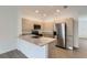 Modern kitchen featuring stainless steel appliances and stone countertops at 1217 S Station Pl # 502, Orlando, FL 32809