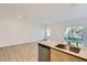 Spacious living room with sliding glass doors leading to the outdoors and stone countertop at 1217 S Station Pl # 502, Orlando, FL 32809