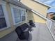 Enjoy the view from this cozy balcony with seating and exterior door access at 136 Mcleods Way, Winter Springs, FL 32708