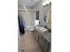 Charming bathroom featuring modern fixtures, stone countertop, and a shower-tub combination at 136 Mcleods Way, Winter Springs, FL 32708