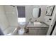 Bright bathroom featuring granite countertop, modern sink, and updated fixtures at 136 Mcleods Way, Winter Springs, FL 32708
