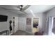 Cozy bedroom featuring a ceiling fan, neutral walls, and access to an ensuite bathroom at 136 Mcleods Way, Winter Springs, FL 32708