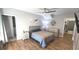 Cozy bedroom features laminate floors, ceiling fan, and closet space at 136 Mcleods Way, Winter Springs, FL 32708