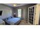 Cozy bedroom featuring a neutral color palette, a ceiling fan, and natural light from the window at 136 Mcleods Way, Winter Springs, FL 32708