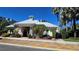 Community clubhouse with palm trees and tropical plants at 136 Mcleods Way, Winter Springs, FL 32708
