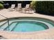 Relaxing hot tub with clear water surrounded by brick and lounge chairs, perfect for unwinding at 136 Mcleods Way, Winter Springs, FL 32708