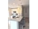 Modern kitchen boasts granite countertops, stainless steel appliances, and breakfast bar with seating at 136 Mcleods Way, Winter Springs, FL 32708