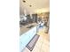 Kitchen features granite countertops, island with seating, and stainless steel appliances at 136 Mcleods Way, Winter Springs, FL 32708