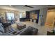 Open living room boasts a dining area, breakfast bar, modern lighting, and tile floors at 136 Mcleods Way, Winter Springs, FL 32708
