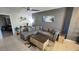 Inviting living room featuring a plush sectional sofa, stylish coffee table, and contemporary decor at 136 Mcleods Way, Winter Springs, FL 32708