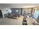 Open-concept living and dining area with modern decor, granite countertops, and stainless steel appliances at 136 Mcleods Way, Winter Springs, FL 32708