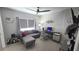Cozy home office with gray sofa, desk, computer, and a large window for natural light at 136 Mcleods Way, Winter Springs, FL 32708