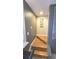 Stylish stairway featuring wood steps, a gray accent wall, and modern railings at 136 Mcleods Way, Winter Springs, FL 32708