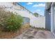 Enclosed backyard area with a concrete patio and white fence at 140 Coco Plum, Davenport, FL 33897