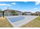 Full-sized basketball court in a well-maintained community space offers opportunities for recreation at 140 Coco Plum, Davenport, FL 33897