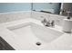Close-up of bathroom sink with granite counters, brushed fixtures and white sink at 140 Coco Plum, Davenport, FL 33897
