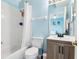 Bright bathroom features a shower and tub combo with modern vanity at 140 Coco Plum, Davenport, FL 33897