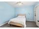 Cozy bedroom with neutral tones, a comfortable bed, and a view to the outside at 140 Coco Plum, Davenport, FL 33897